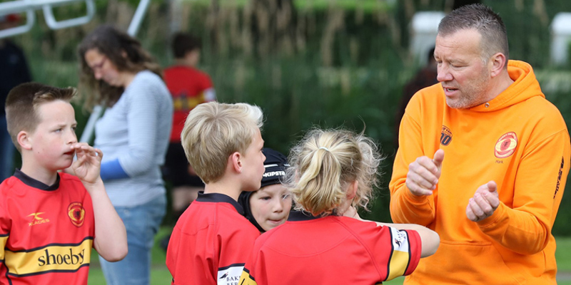 Een beroepskracht op je club 